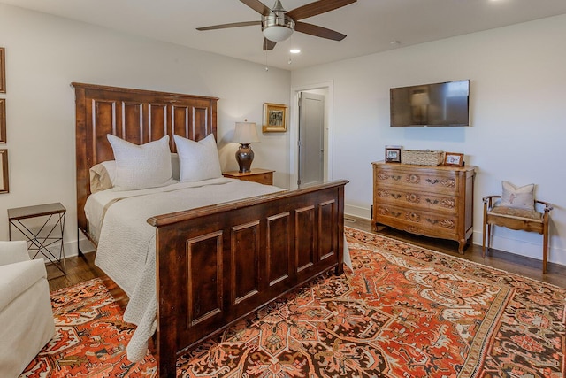 bedroom featuring ceiling fan and dark hardwood / wood-style flooring