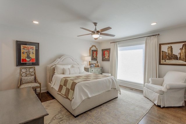 bedroom featuring ceiling fan and wood-type flooring