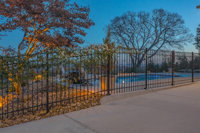 view of gate with a community pool