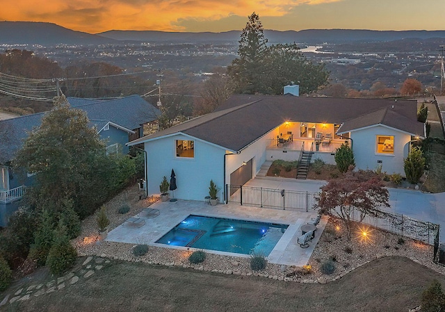 exterior space with a mountain view and a patio