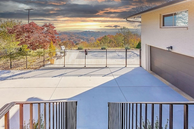 view of patio terrace at dusk