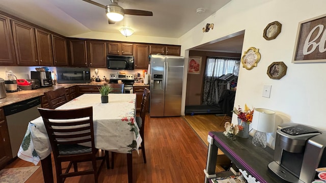 kitchen featuring dark hardwood / wood-style flooring, dark brown cabinetry, stainless steel appliances, and ceiling fan