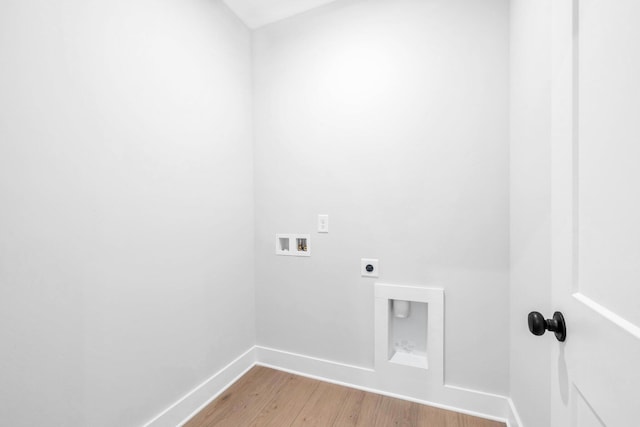 washroom featuring hookup for an electric dryer, hookup for a washing machine, and light hardwood / wood-style flooring