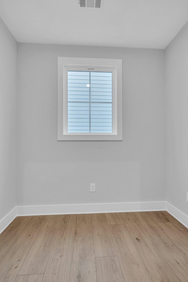 spare room featuring light wood-type flooring