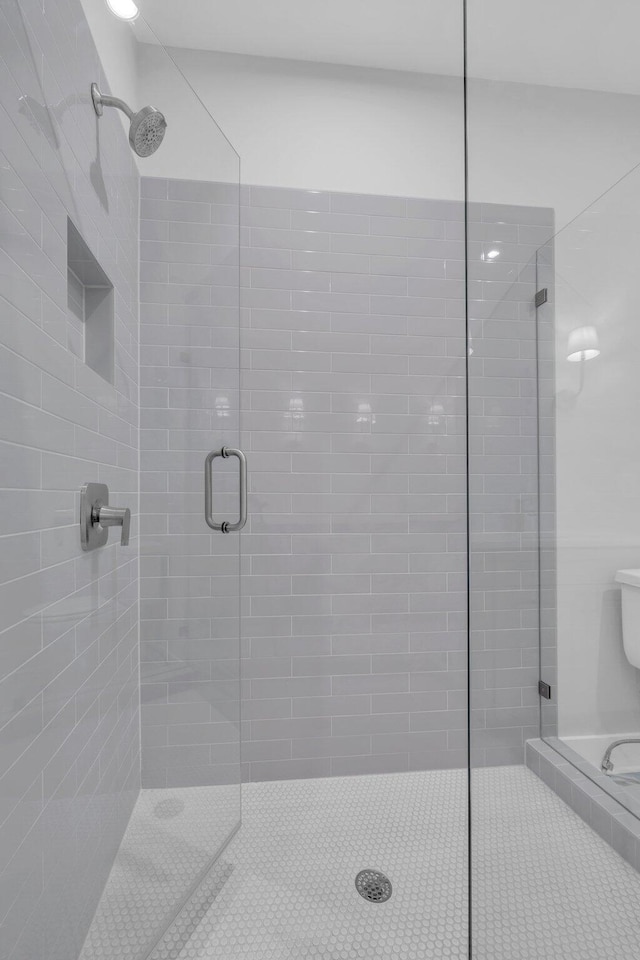 bathroom featuring an enclosed shower