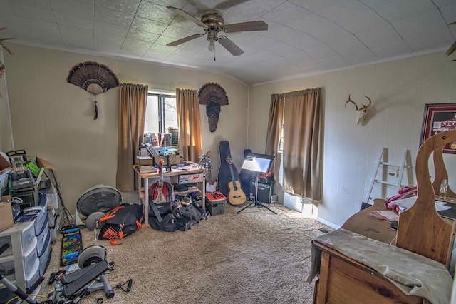 carpeted bedroom with ceiling fan and crown molding