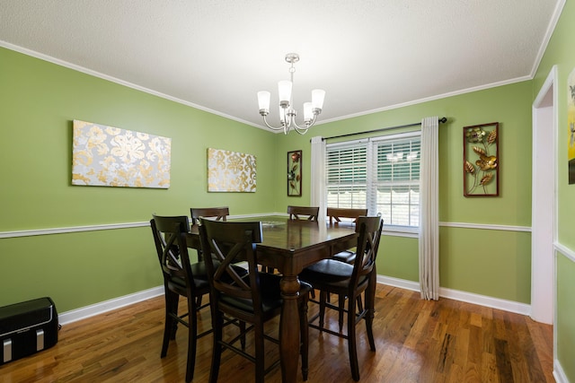 dining area featuring a notable chandelier, dark hardwood / wood-style flooring, and crown molding