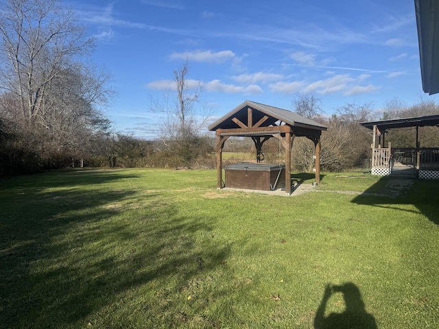 view of yard with a gazebo and a hot tub