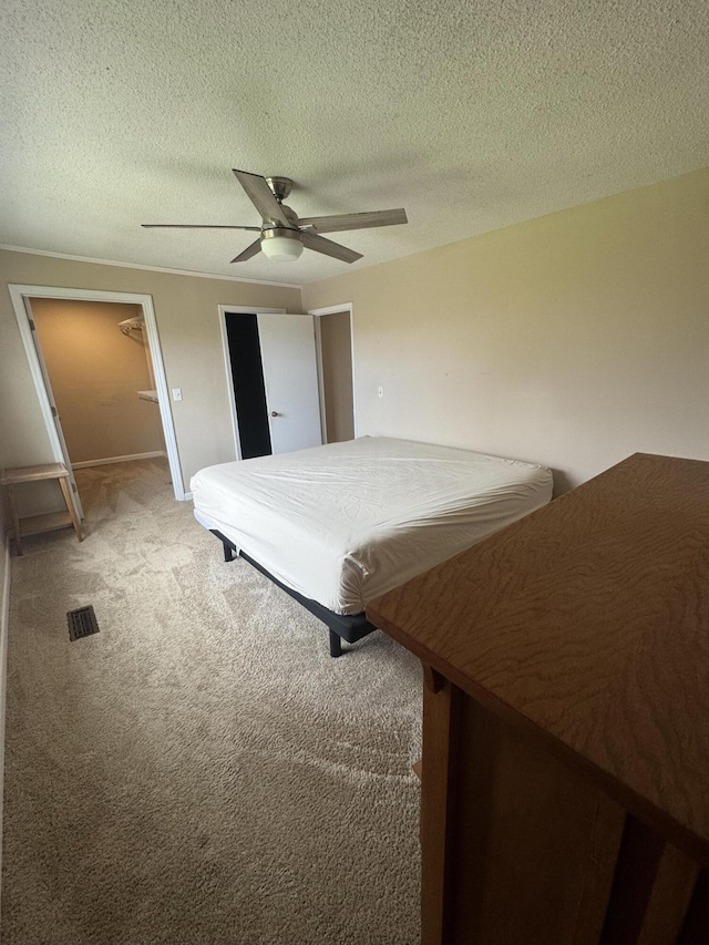 unfurnished bedroom featuring ceiling fan, pool table, carpet floors, and a textured ceiling