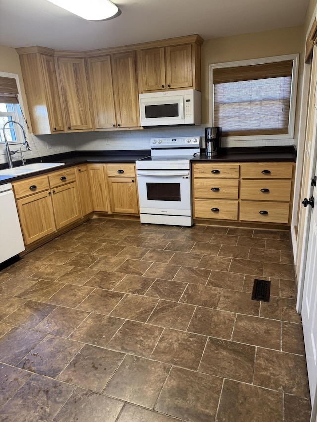 kitchen with sink and white appliances