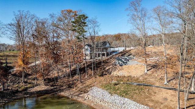 rear view of property with a water view