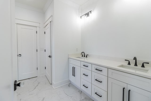 bathroom featuring vanity and ornamental molding