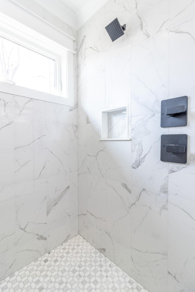 bathroom with tiled shower