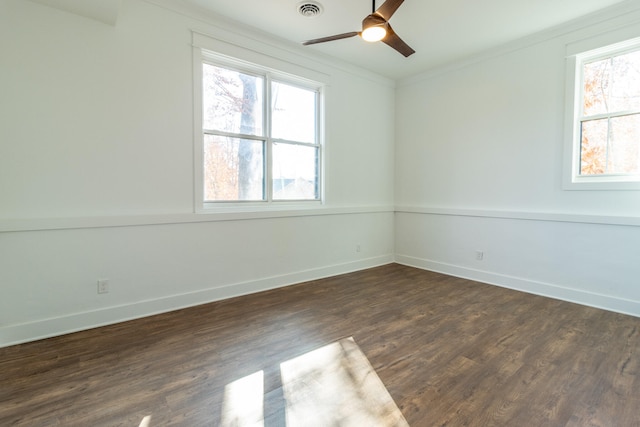 unfurnished room featuring ceiling fan, ornamental molding, and dark wood-type flooring