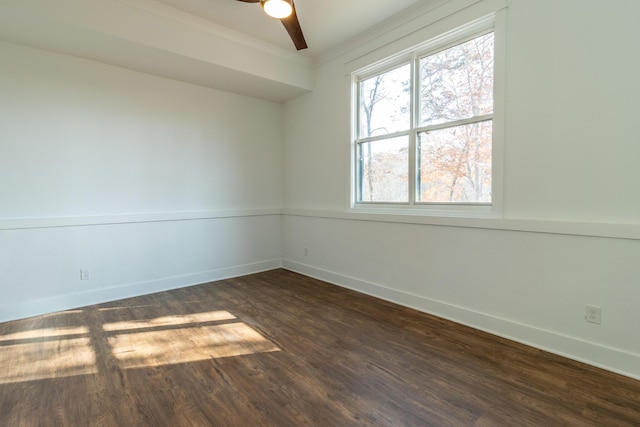 spare room featuring dark hardwood / wood-style floors and ceiling fan