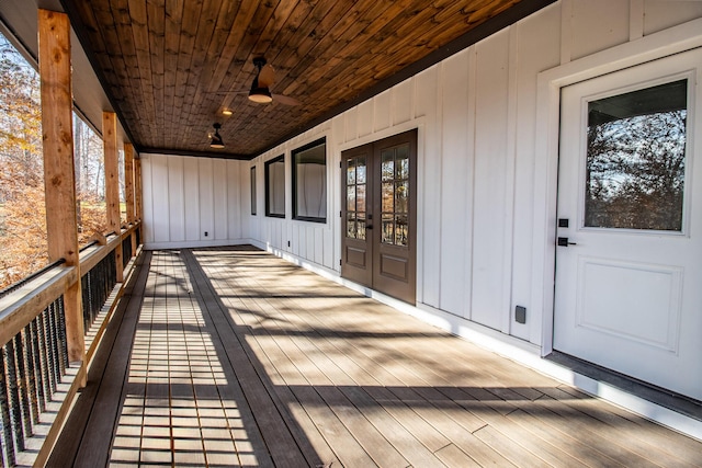 wooden deck with french doors and ceiling fan