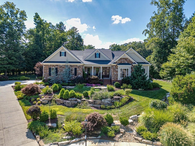 craftsman-style home with a front lawn