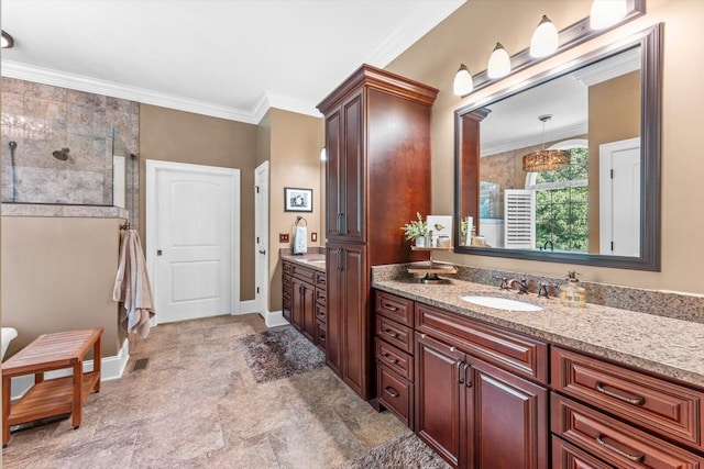 bathroom with ornamental molding and vanity