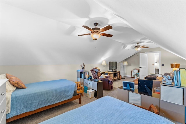 bedroom with ceiling fan, carpet flooring, and vaulted ceiling