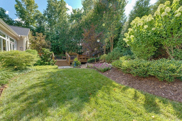 view of yard featuring a deck