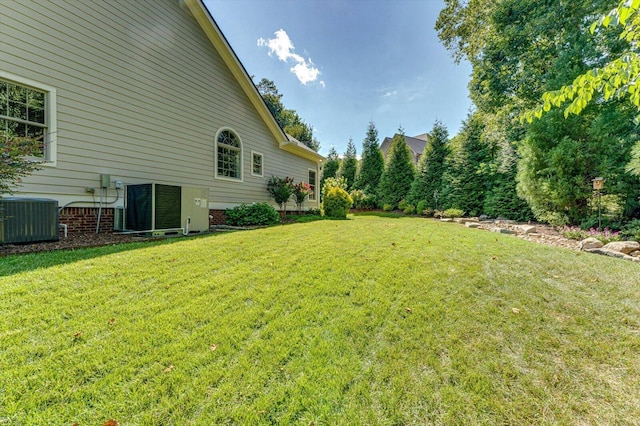 view of yard with central AC