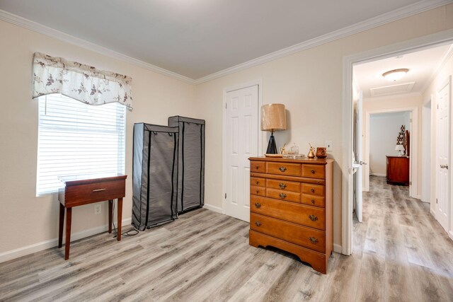 misc room featuring light hardwood / wood-style flooring and ornamental molding