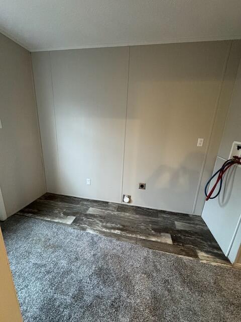 unfurnished room featuring dark hardwood / wood-style flooring