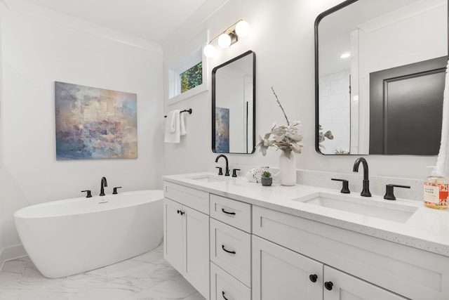 bathroom featuring a bathing tub, vanity, and ornamental molding