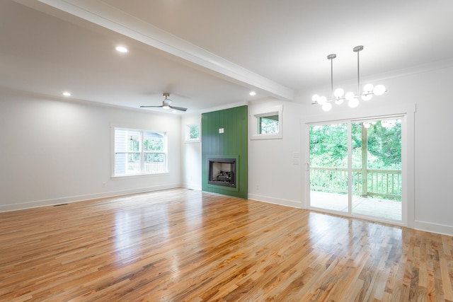 unfurnished living room with beam ceiling, crown molding, light hardwood / wood-style flooring, and ceiling fan with notable chandelier