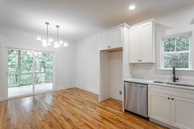 kitchen with dishwasher, white cabinets, sink, a wealth of natural light, and light hardwood / wood-style floors