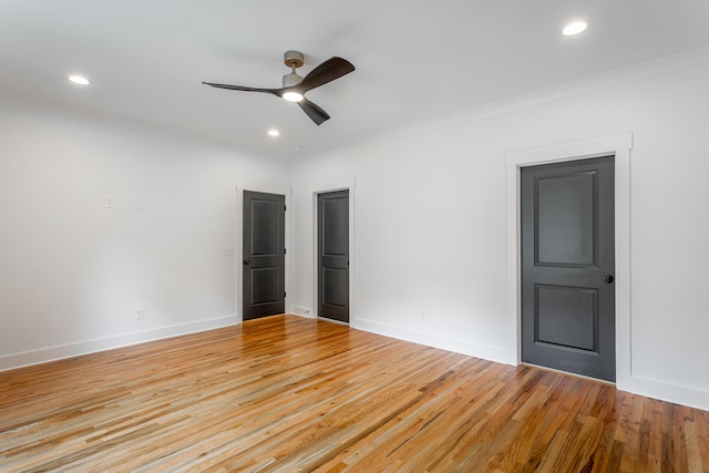 unfurnished bedroom featuring ceiling fan, light hardwood / wood-style floors, and crown molding