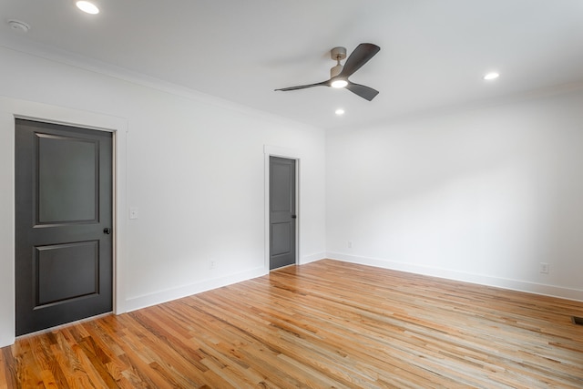 unfurnished room with ceiling fan, light hardwood / wood-style flooring, and ornamental molding