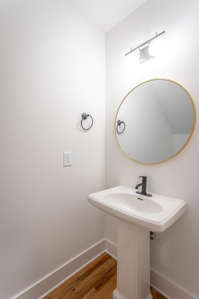 bathroom with hardwood / wood-style flooring