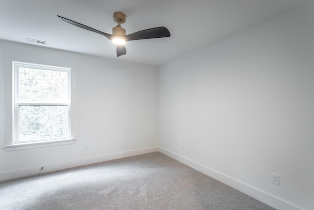 empty room featuring carpet flooring and ceiling fan