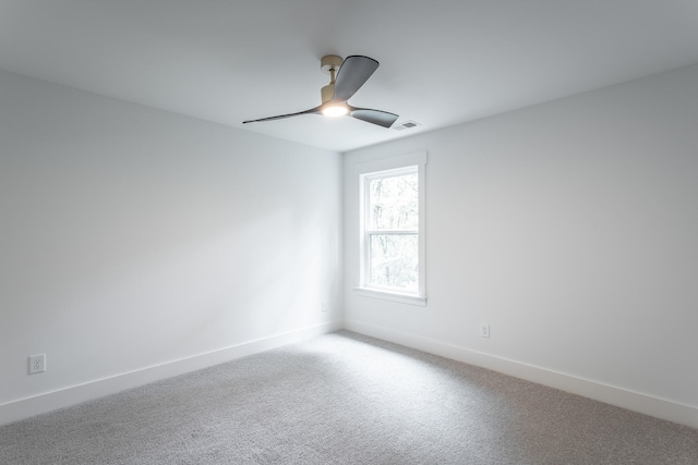 carpeted empty room with ceiling fan