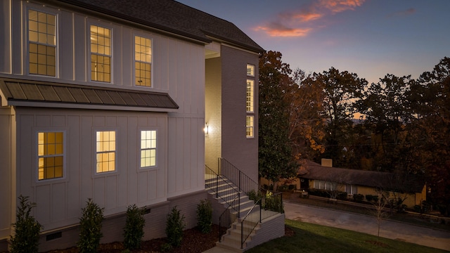 view of property exterior at dusk