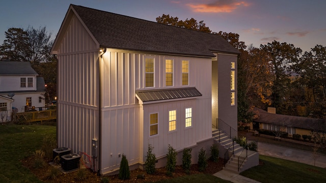 view of front of home featuring central air condition unit