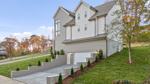 view of home's exterior with a yard and a garage