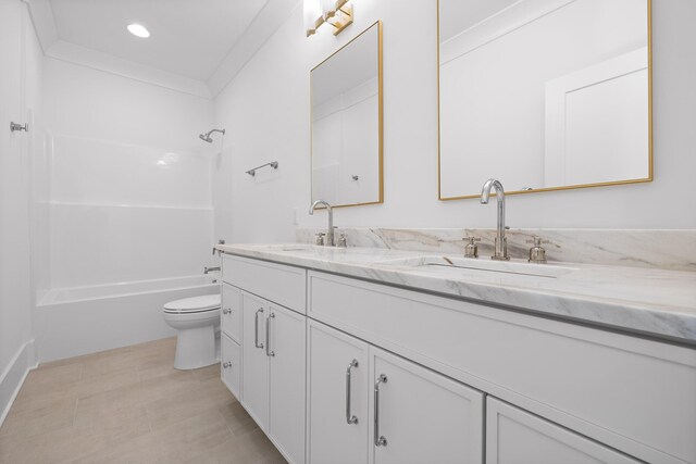 full bathroom with vanity, ornamental molding,  shower combination, and toilet