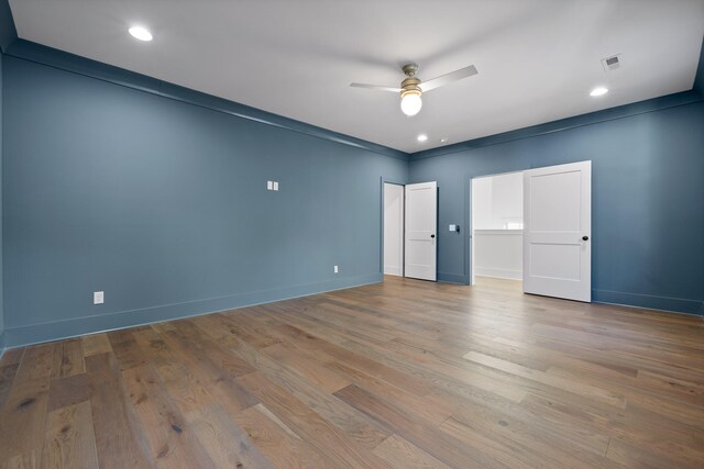 unfurnished bedroom with ceiling fan, light hardwood / wood-style flooring, and ornamental molding