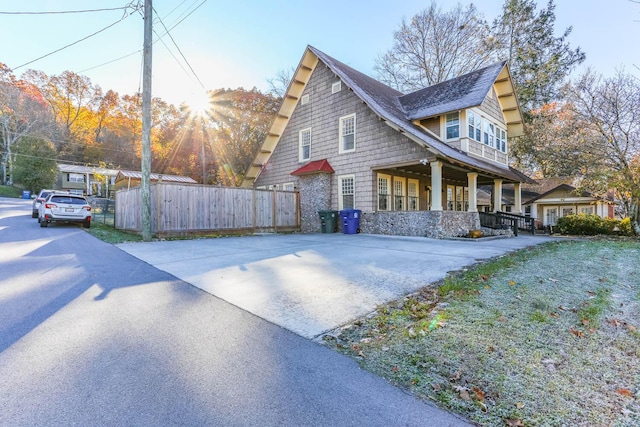 view of side of home featuring a porch