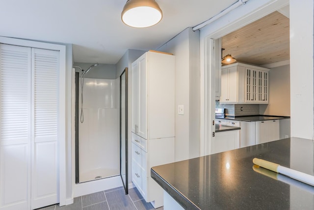 kitchen with white cabinets and backsplash