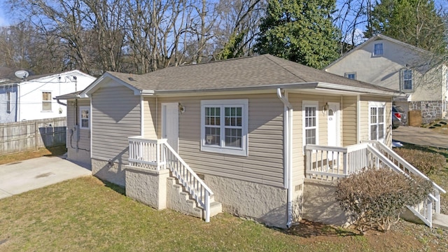 bungalow with a front yard