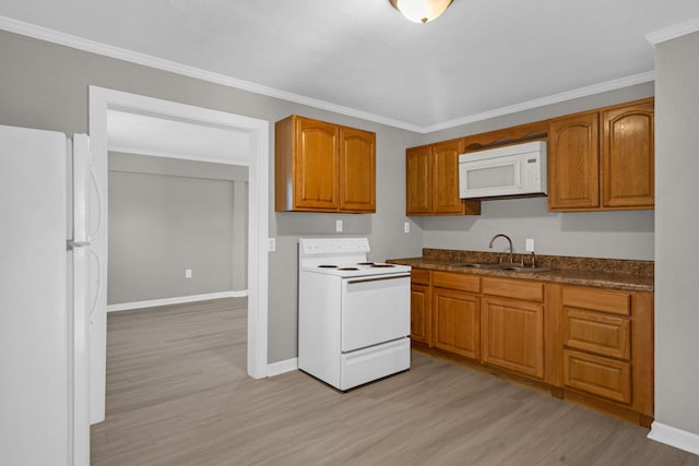 kitchen with white appliances, ornamental molding, light hardwood / wood-style floors, and sink