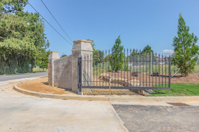 view of gate with fence