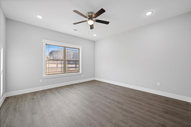 spare room featuring visible vents, baseboards, dark wood-style floors, ceiling fan, and recessed lighting