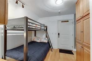 bedroom with light wood-type flooring