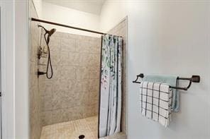 bathroom with a shower with shower curtain