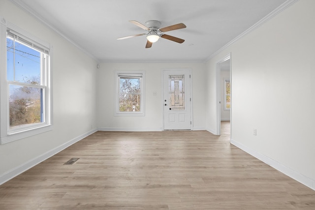 interior space with crown molding, ceiling fan, and light hardwood / wood-style floors