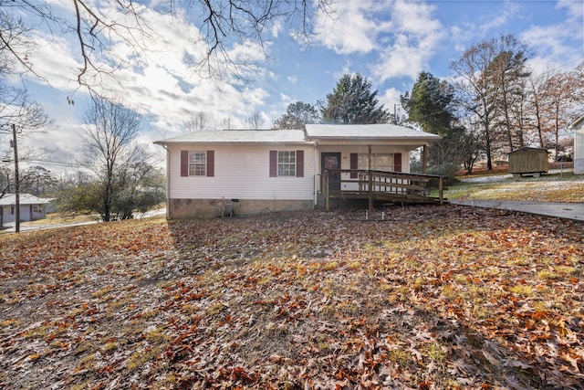 rear view of property with covered porch